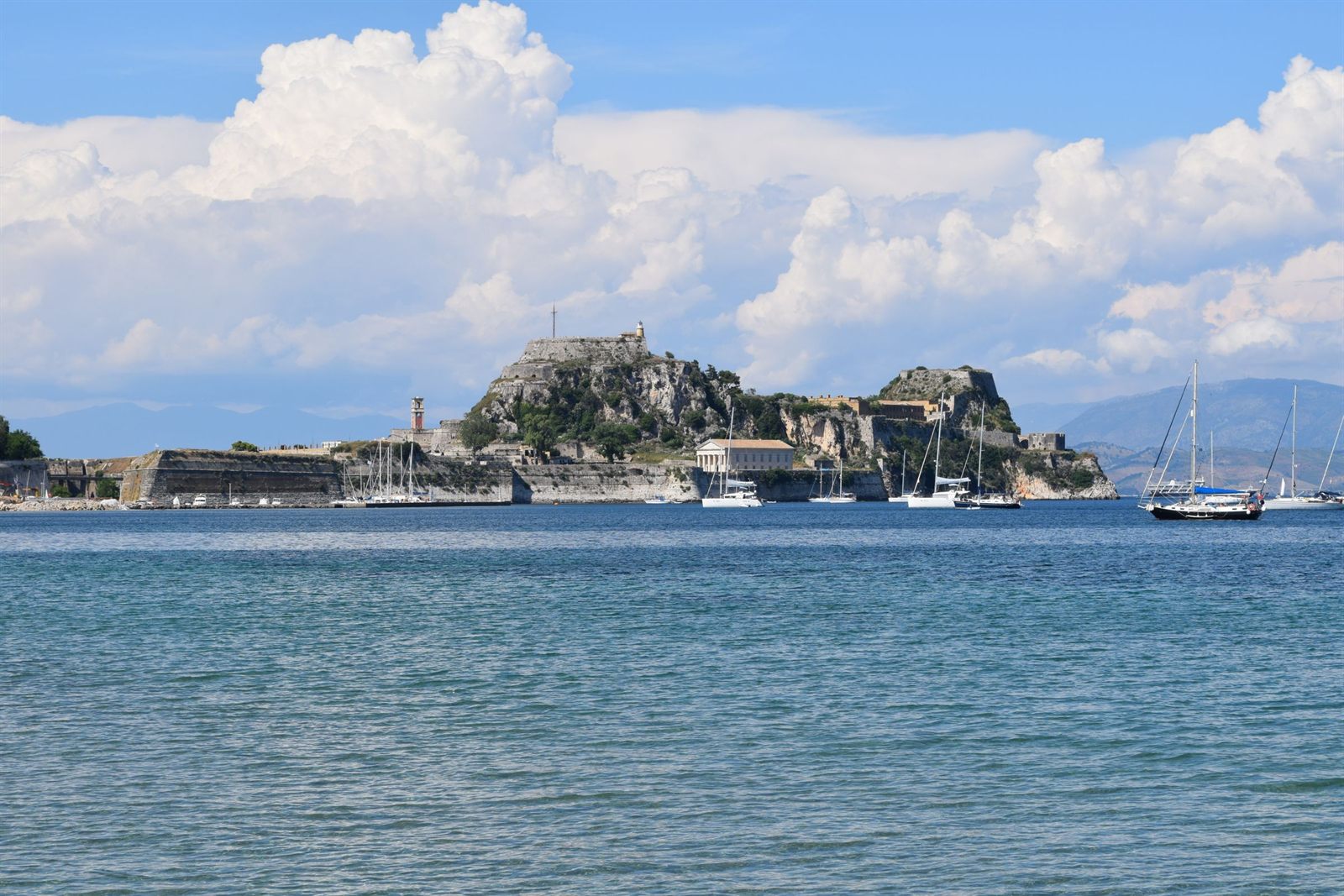 Old Fortress of Corfu on its rocky headland across blue water